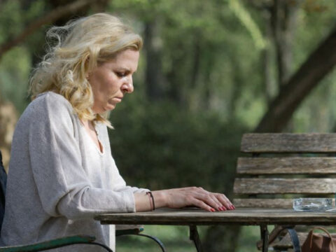 Woman at picnic table
